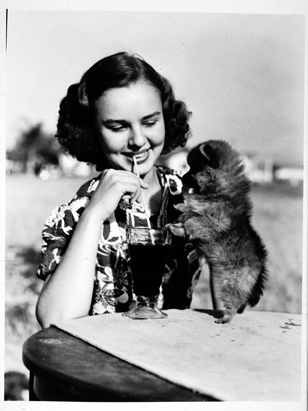 woman holding a puppy